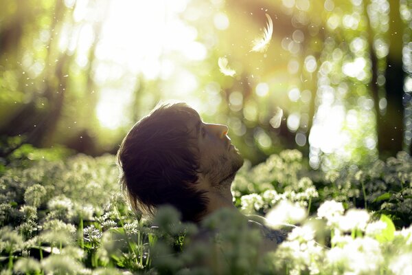 A guy in the woods in nature in the mood