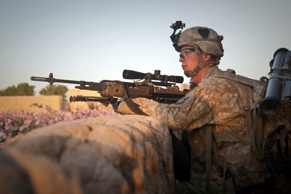 A soldier with a weapon is ready to attack