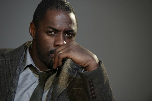 Idris Elba pondered raising his hand to his face