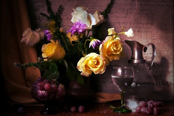 Bouquet of flowers in a jug next to the jug