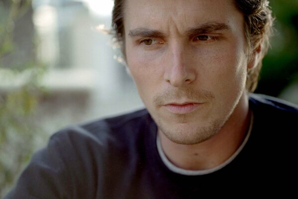 Thoughtful Christian Bale pursed his lips