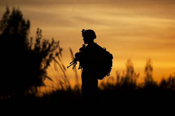 Silhouette of a soldier against the sunset