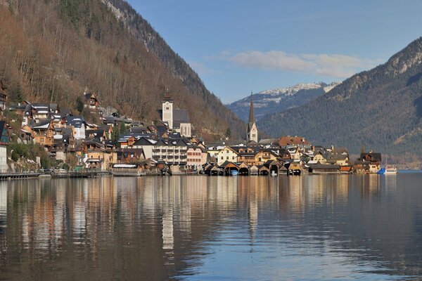 The Austrian town is hidden at the foot of the mountains and a beautiful lake