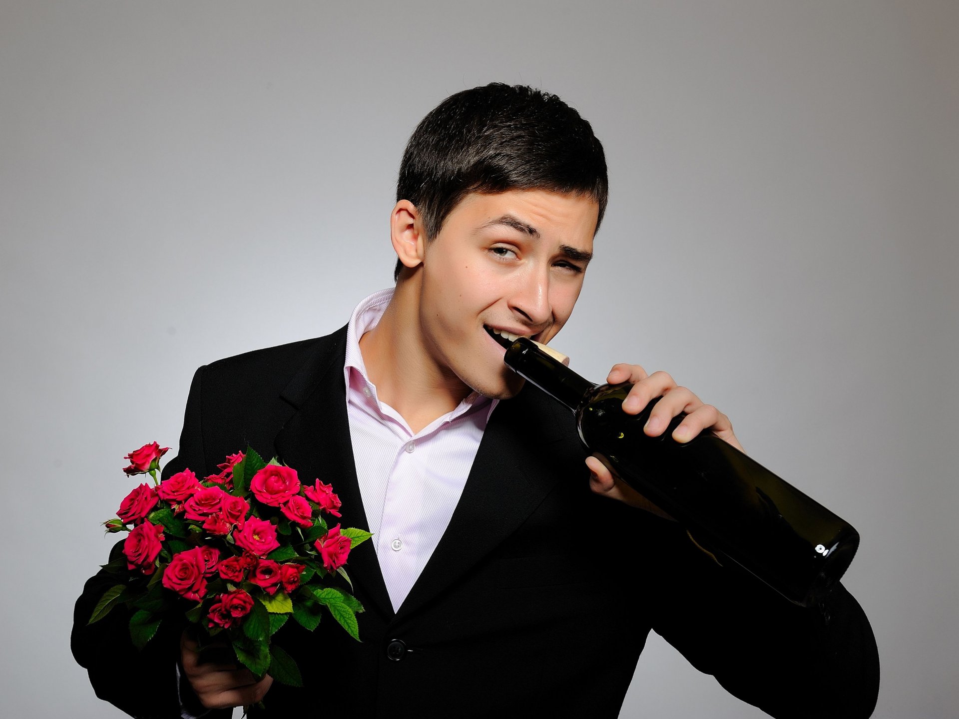 real gentleman cute suit guy bouquet red roses a bottle view gentleman