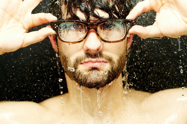 Wet man with glasses