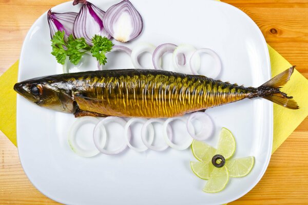 Smoked fish with onions on a plate