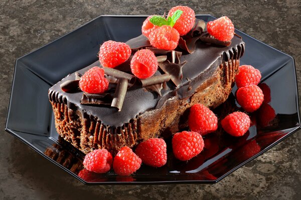 Chocolate dessert with juicy raspberries