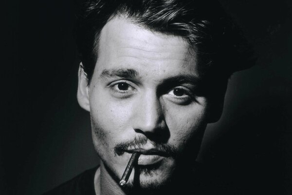 Black and white portrait of Johnny depp with a cigarette