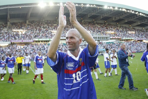 The great football player claps his hands