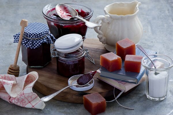 Still life with jam jars, marmalade, sugar and milk jug