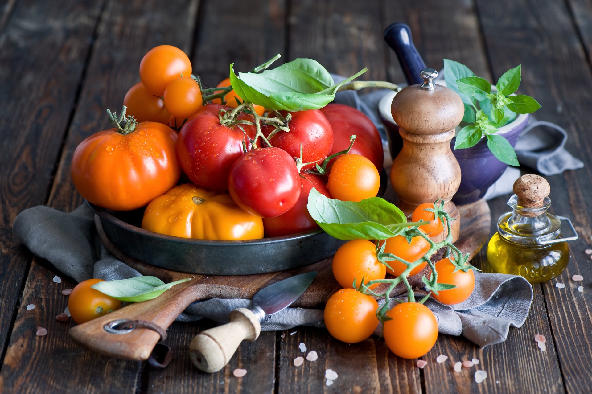 tomatoes red yellow vegetables oil leaves tableware