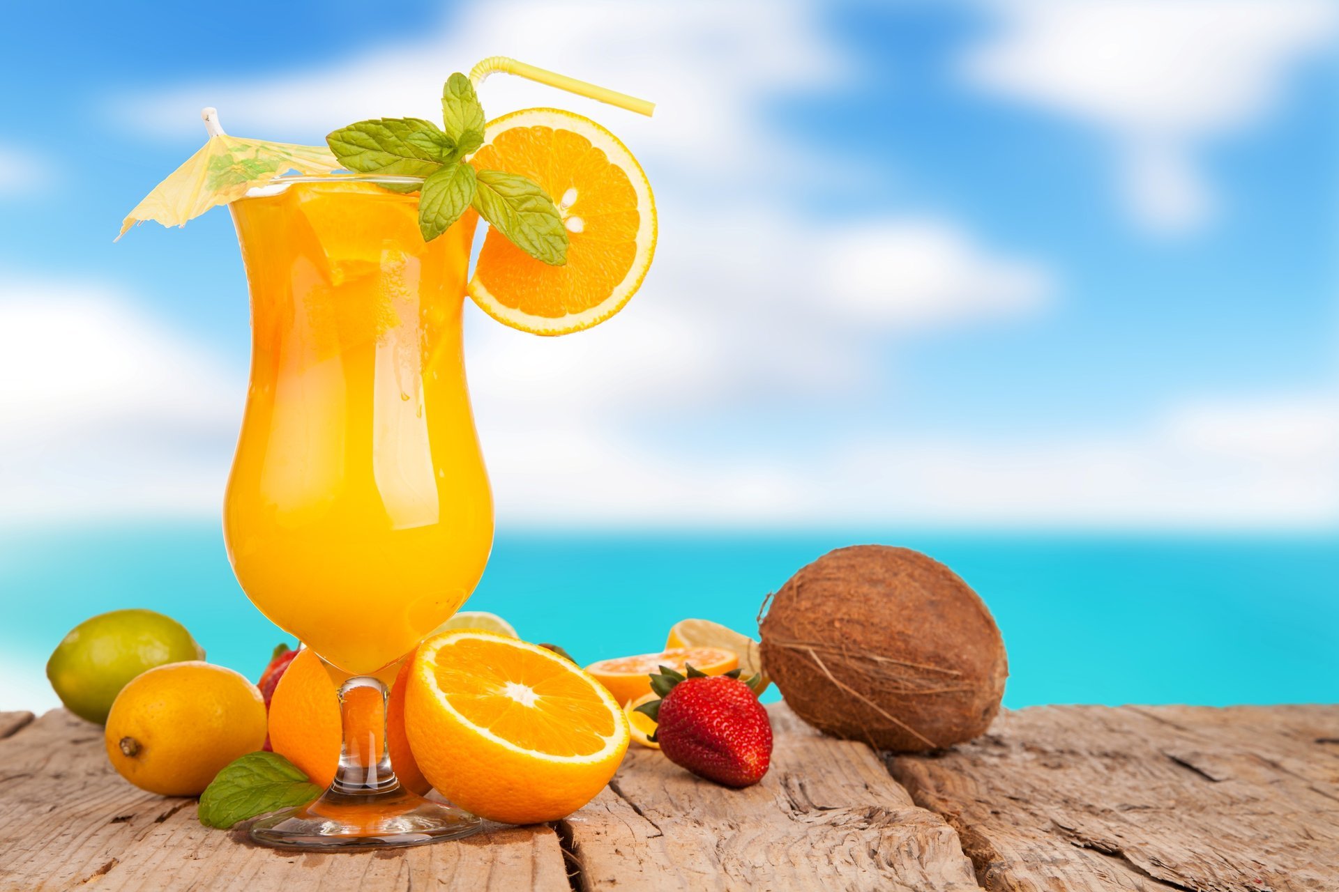 juice oranges lime lemon strawberry coconut delicious summer background sea the sky