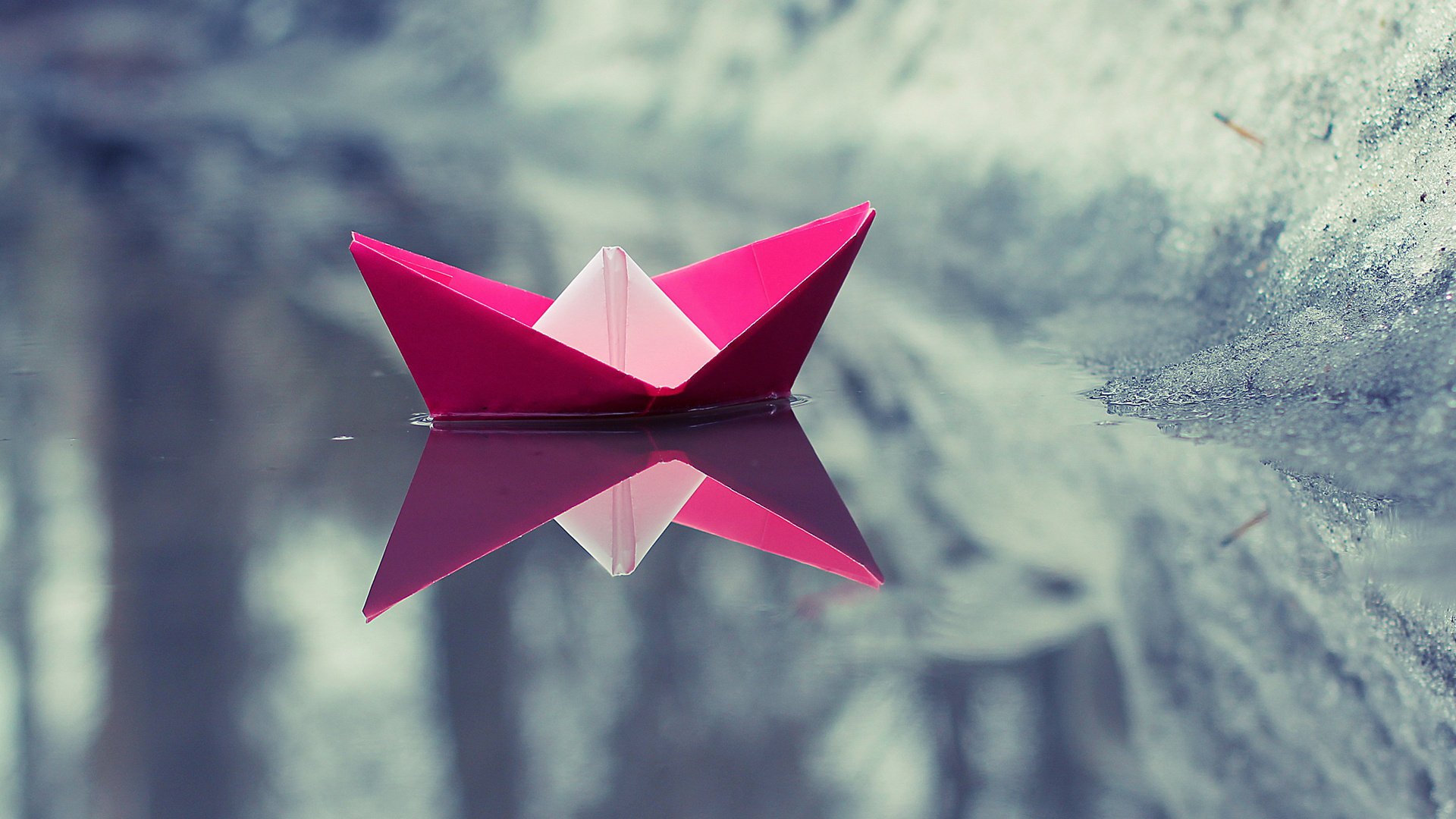 paper boat reflection water