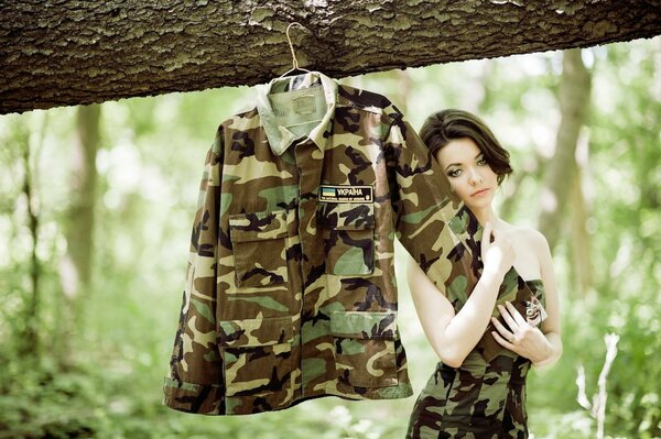 Beautiful brunette outdoors in a khaki dress