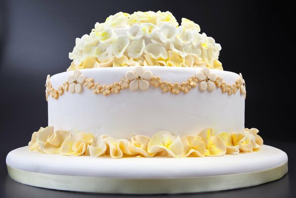 Wedding cake with yellow and white lilies