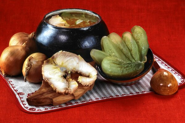 A pot of fish stew and vegetables