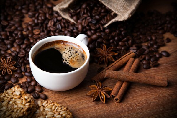 Still-life. A mug of coffee and cinnamon next to it