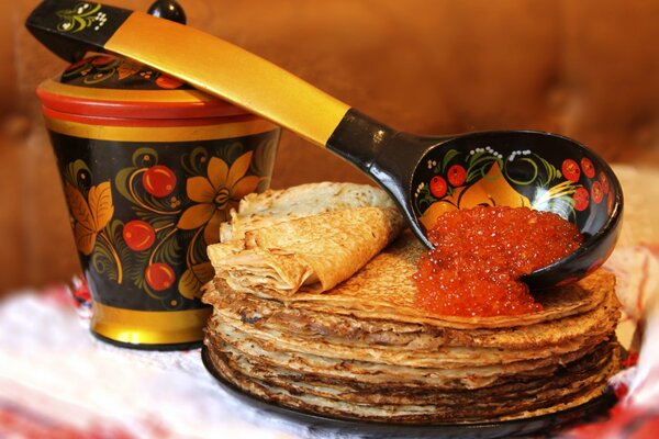 Beautiful still life with pancakes and caviar for Maslenitsa