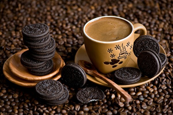 A cup of coffee and oreo for dessert