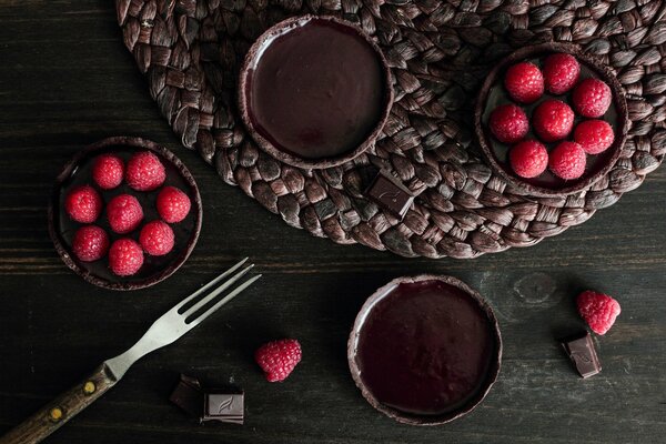 Chocolate brownies with raspberries on the table