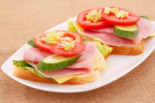 Sandwiches with cheese, ham and vegetables