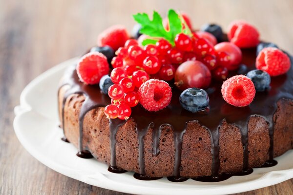 Dessert poured with chocolate and berries