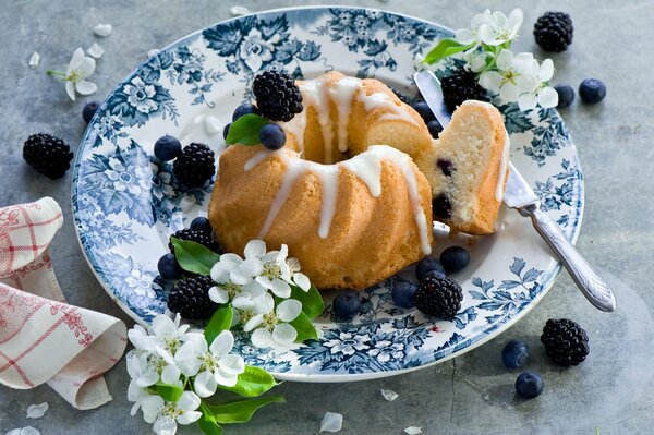 The most delicate cupcake with blueberries and blackberries