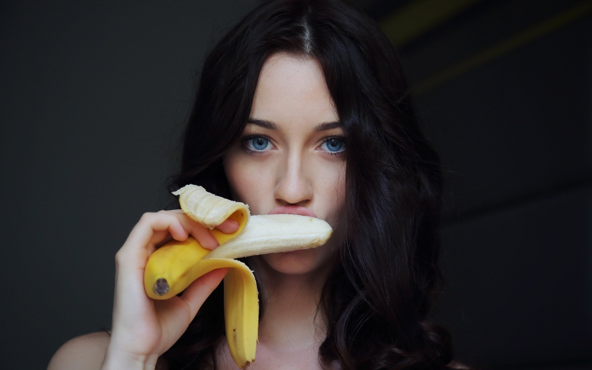 girl brunette face banana view