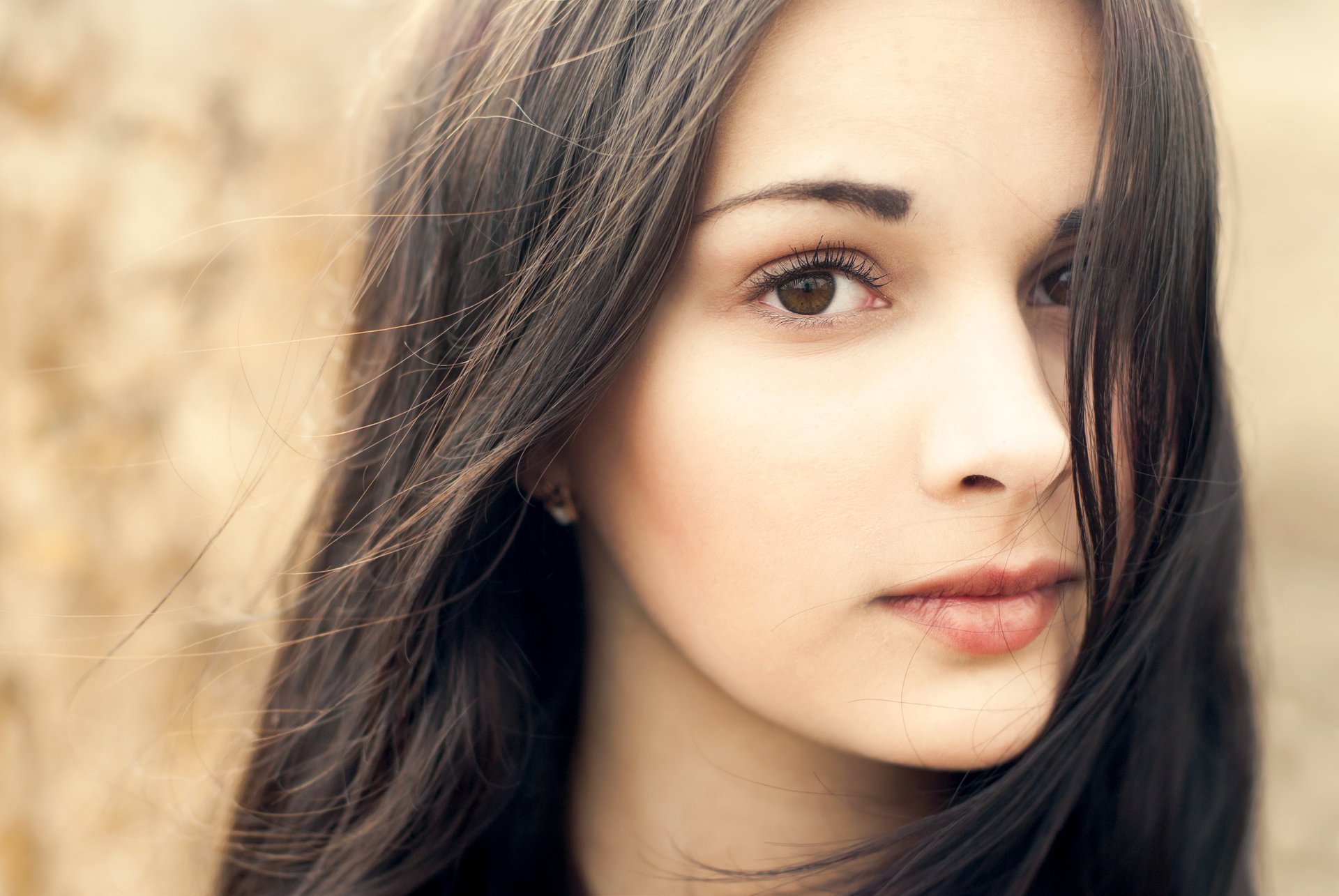 girl beautiful view brown eyes face lips. hair earrings background