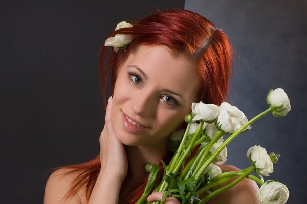 Red-haired girl with white flowers