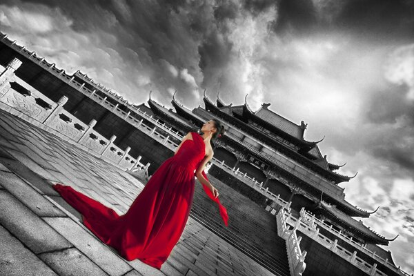 A girl in a long red dress