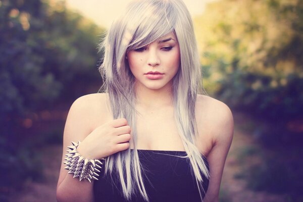 Blonde girl with an unusual bracelet on her arm