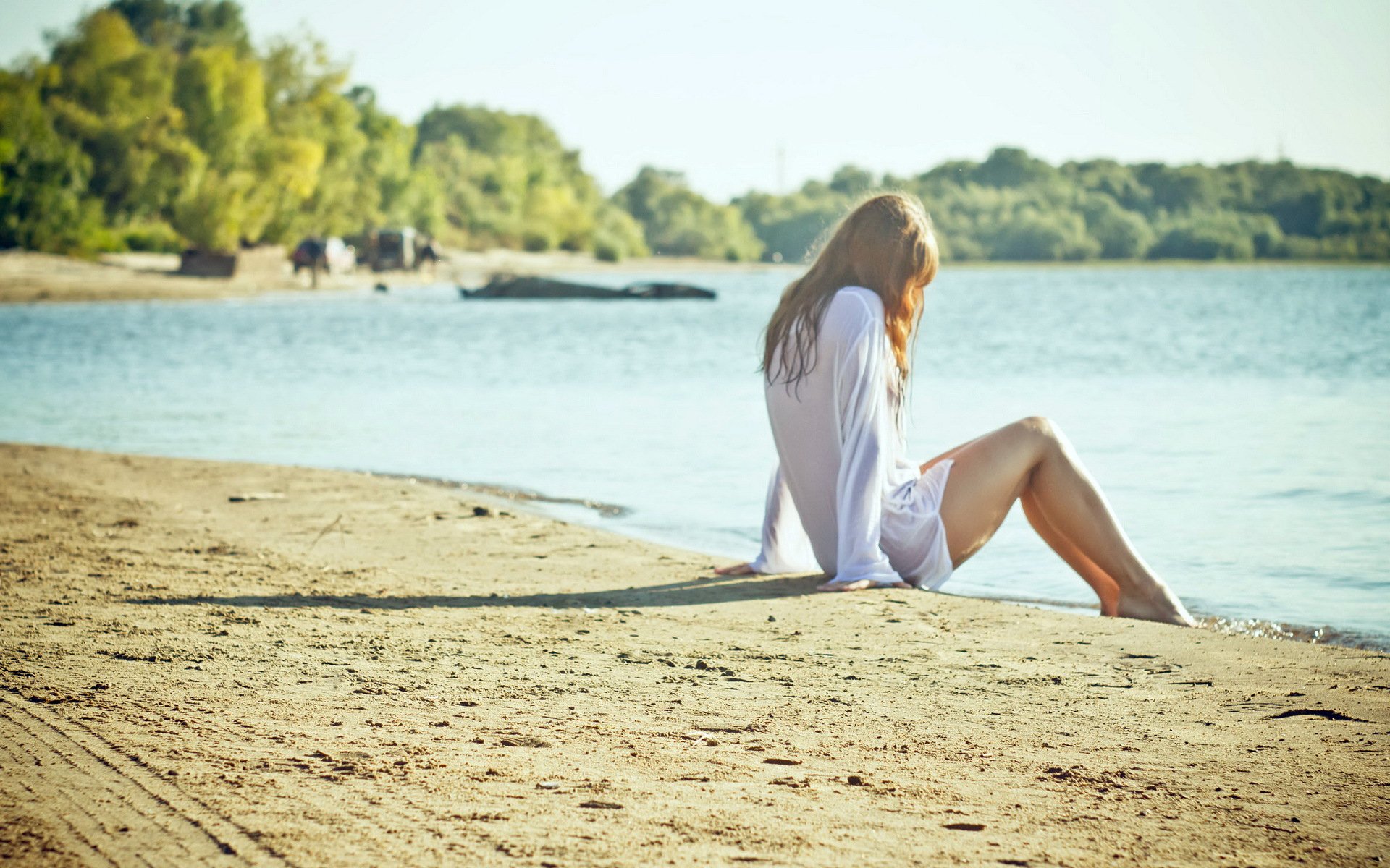 girl blonde beach sand sitting