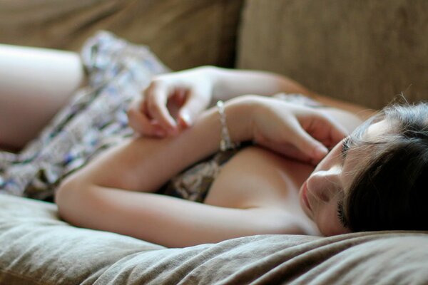 Sleeping girl with a bracelet on her arm