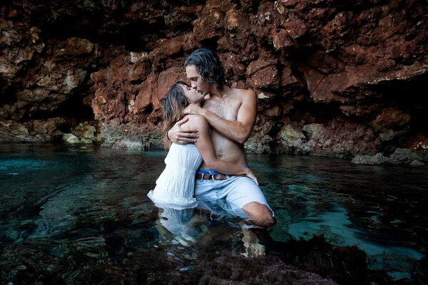 A couple in love kissing in the water