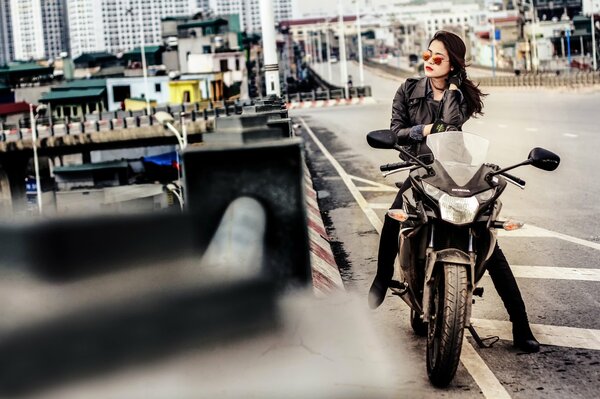 Beautiful girl on a Honda motorcycle