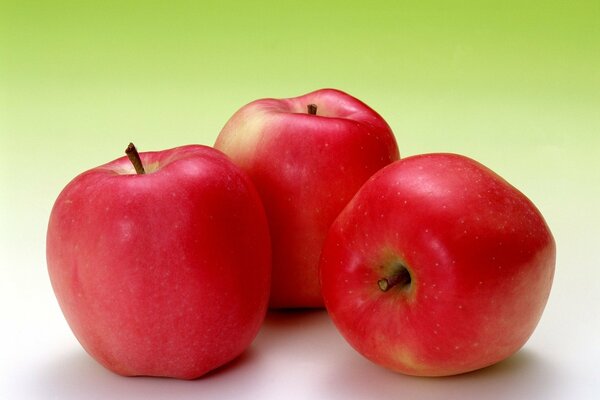 Red juicy apples as background wallpaper