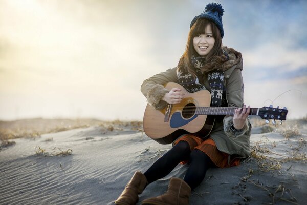 Fille jouant de la guitare