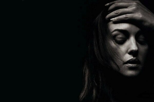 Black and white photo of the actress s face on a black background