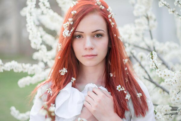 Spring portrait of a red-haired girl