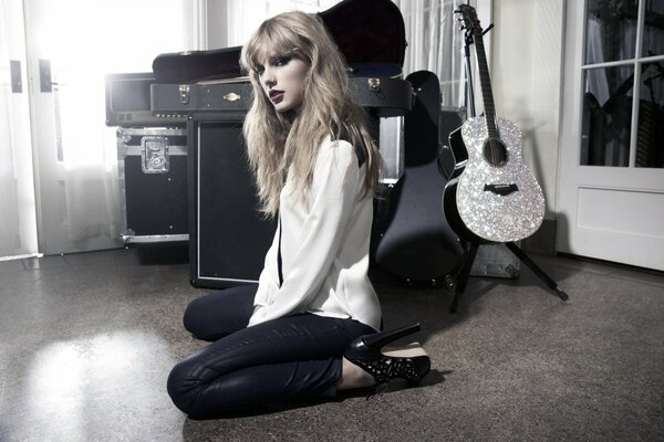 Photo of a girl in a shirt with a guitar