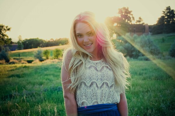 Photo of a girl in the rays of the sun