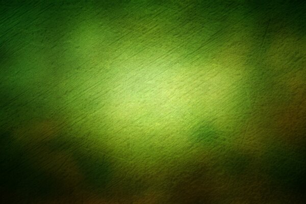 A light green spot on a dark green background