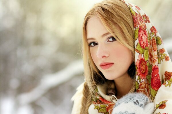 A blonde girl in a bright scarf