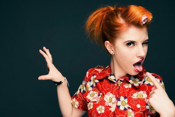 Hayley williams with curlers and shows tongue