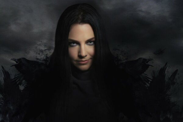 Amy Lee von der Evanescence Band in Schwarz und mit Krähen hinter den Schultern