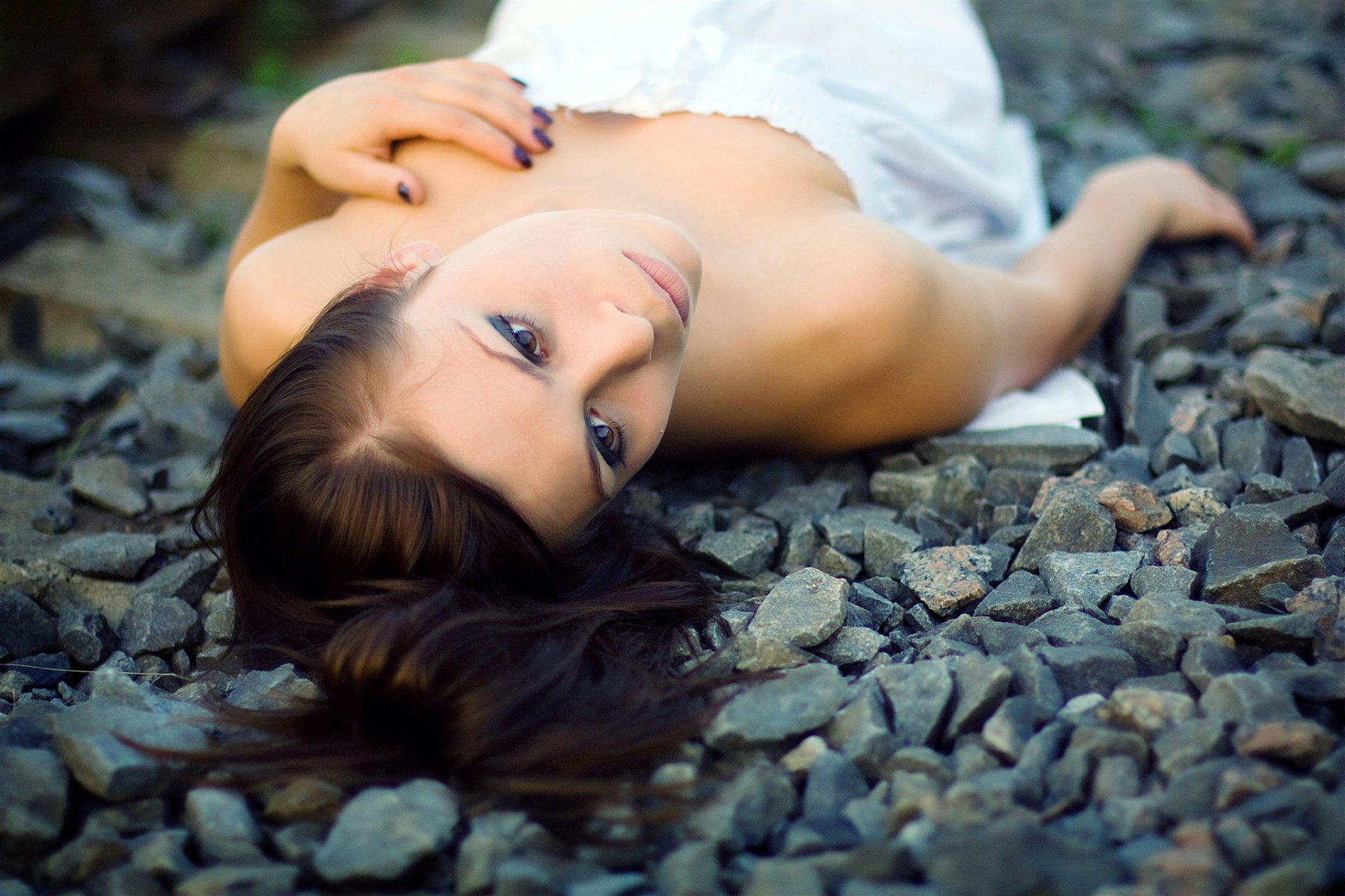 background stones rubble pebbles girl face hair view brown hair white dress sundre