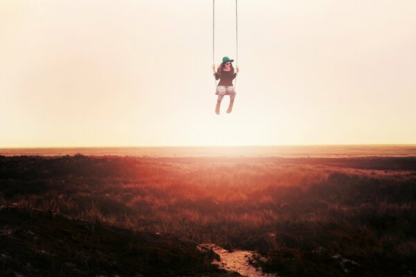 The girl on the swing is afraid of heights and it takes her breath away