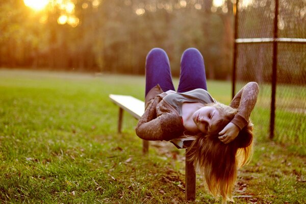 A girl on a bench in the woods