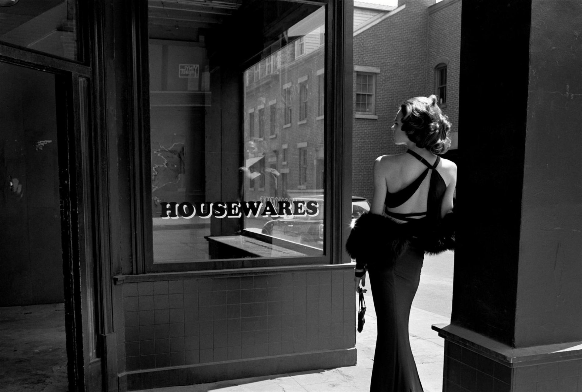 howcases empty shop doors street girl spin dress day photo black and white